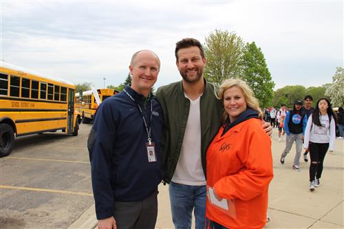 Bartlett High graduate Chris Bukowski visits with BHS Athletic Director Jeff Bral and Dean's Assistant Kathy Prince